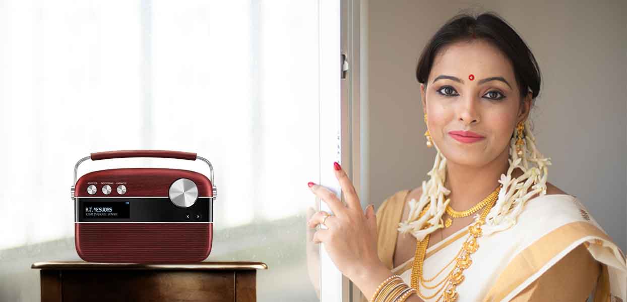 Husband and wife listening to Malayalam carvaan music